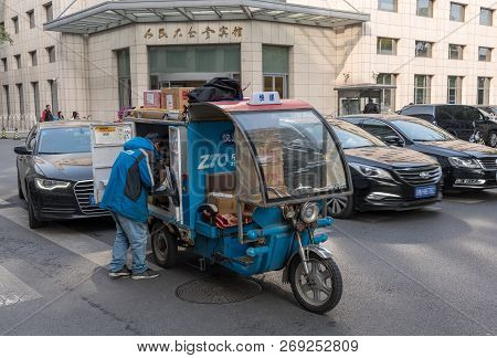 Beijing, China - 19 October 2018: Zto Courier Truck Delivering Parcels In Central Beijing