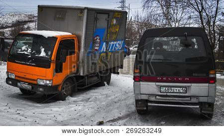 Kazakhstan, Ust-kamenogorsk, November 16, 2018: Nissan Diesel And Mitsubishi Delica Parked. Bright O