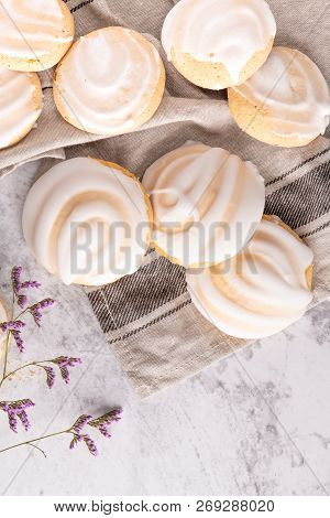 Cookies With Egg White Cover. Portuguese Sweets Known As Cavacas On Napkin In A Table.