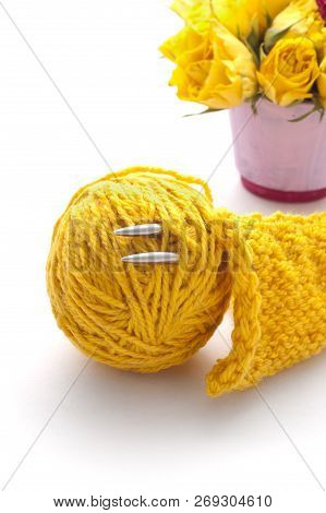 Yellow Wollen Thread And Roses Out Of Focus