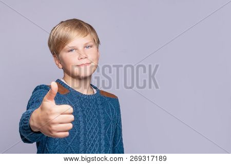 Handsome Teen Boy 12-14 Year Old Showing Thumb Up Sign - Gesture Of Approval And Success