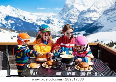 Family Apres Ski Lunch In Mountains. Skiing Fun.