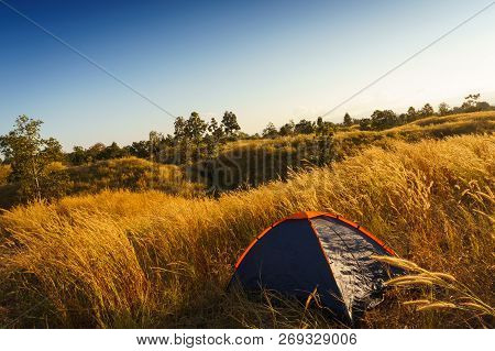 Outdoors Camping Grass Highlands Mountain In The Sunset.