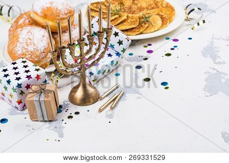 Jewish Holiday Hanukkah Background. Traditional Dishes - Sweet Doughnuts And Potato Latkes. Hanukkah