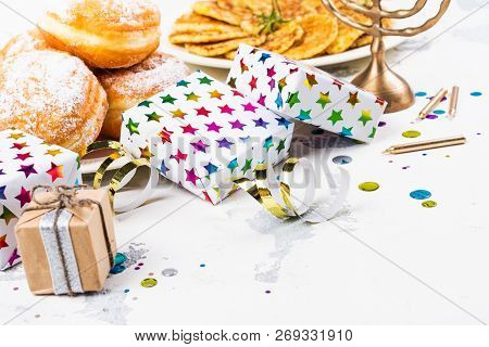 Jewish Holiday Hanukkah Background. Traditional Dishes - Sweet Doughnuts And Potato Latkes. Hanukkah