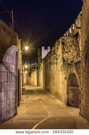 Ancient Medieval Fortification Wall At Old Town Alcudia, Mallorca Spain At Night
