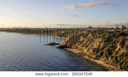 Cliffs And City In Background At Sunset Aerial Photo