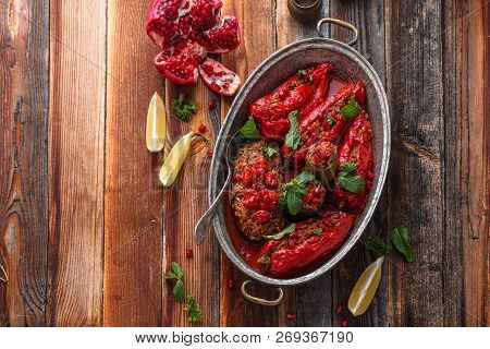 Baked Red Ramiro Peppers Stuffed With Rice And Walnuts, Rustic Style, Copy Space.