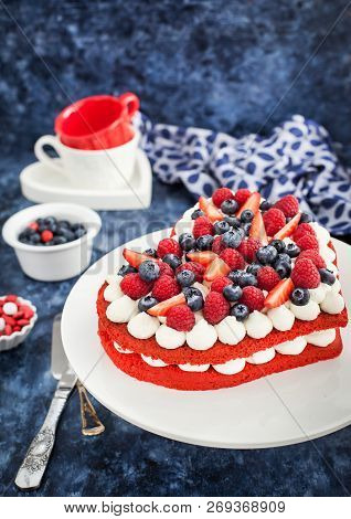 Delicious Homemade Heart Shaped Red Velvet Cake Decorated With Cream And Fresh Berries