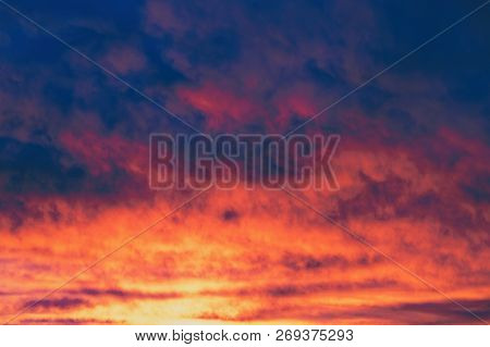 Gloomy Autumn Sky Backlit By The Sunrise, As A Background