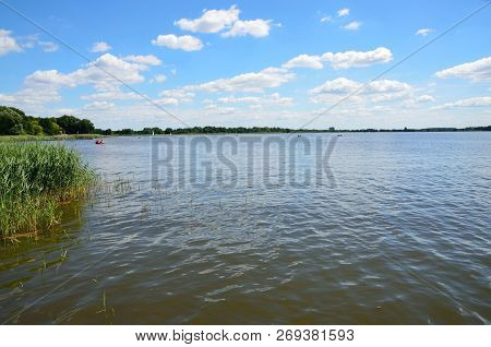 Landscape In Poland. Wielenskie Lake In Wielen. Blue Sky With Single Clouds And Clean Water.