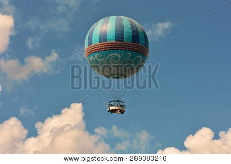 Orlando, Florida; July 29  2018 Air Balloon Flying On The Blue Sky At Lake Buena Vista.