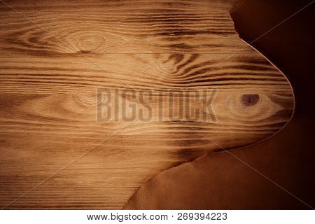 Leather Craft On Wooden Background. Tanners Workshop. Copyspace.