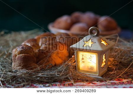 Christmas Still Life. Donuts And Kalach On The Table Covered With Hay