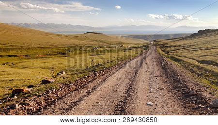 Unpaved Road And Yurts Near Son-kul Lake And Tien Shan Mountains In Kyrgyzstan