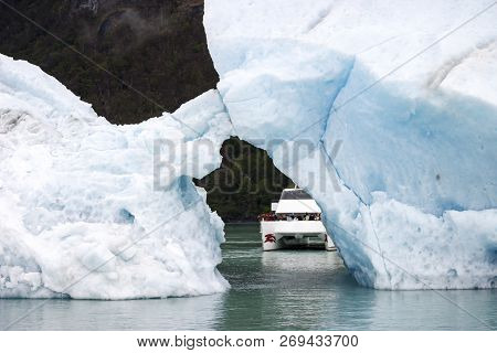 Sailing Between Icebergs Floating In The Water Navigating The Upsala Channel In The Glacier National