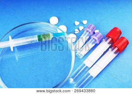 Medicines, Drugs, Doping, Test Tubes, Syringe, Petri Dish On A Blue Background.