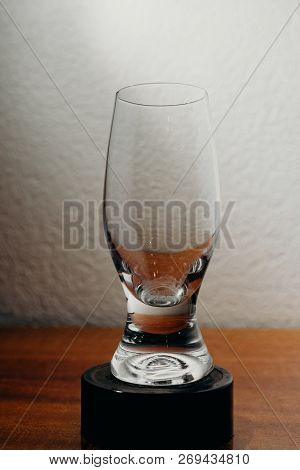 Dirty Glass Of Smusy With The Superheated Grounds On A White Background
