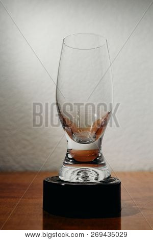 Dirty Glass Of Smusy With The Superheated Grounds On A White Background