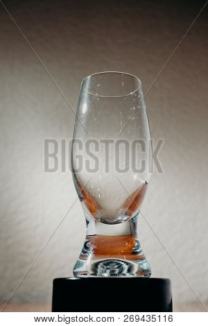 Dirty Glass Of Smusy With The Superheated Grounds On A White Background