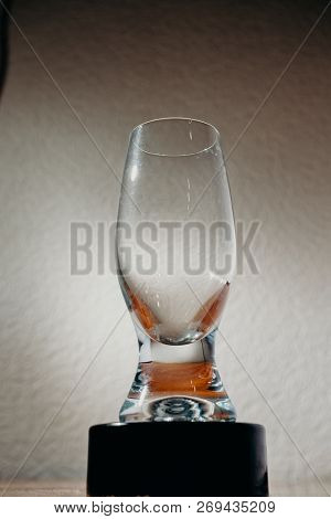 Dirty Glass Of Smusy With The Superheated Grounds On A White Background