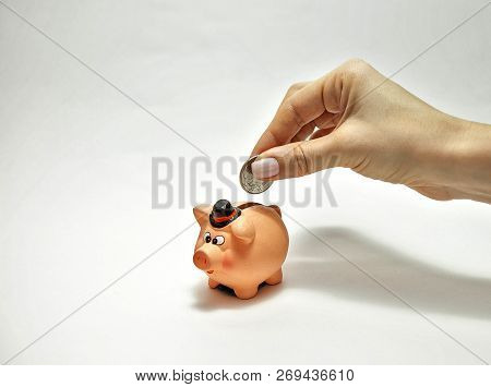 Put The Coin In The Piggy Bank