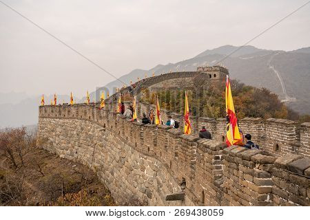 Mutianyu, China - 20 October 2018: Tourists On The Great Wall Of China At Mutianyu On Smoggy Day