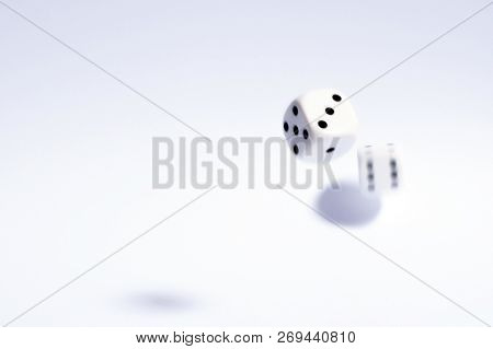 Shot Of Dice Which Have Been Thrown And Randomly Bouncing.