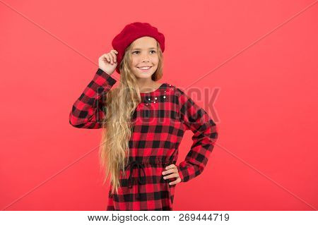How To Wear Beret Like Fashion Girl. Kid Little Cute Girl With Long Hair Posing In Hat Red Backgroun