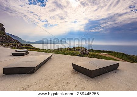 Kleivodden Rest Stop Area Viewpoint With Stone Seating Bench. Arctic Ocean View With Clouds Sky. Att