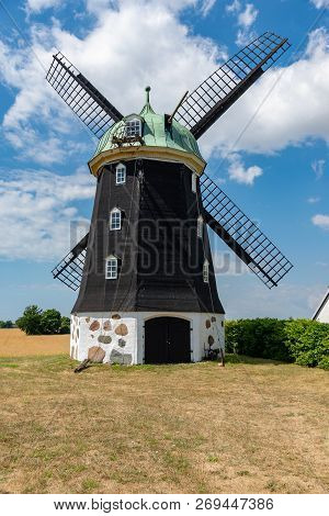 Wheat Windmill. Harvest Concent. The Stock Photo.