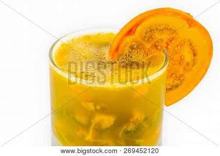 Traditional Colombian Beverage Made Of Juice And Pieces Of Lulo (solanum Quitoense) Called Lulada