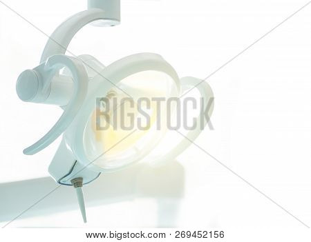 Close Up Of Shining Dental Lamp In Modern Clinic