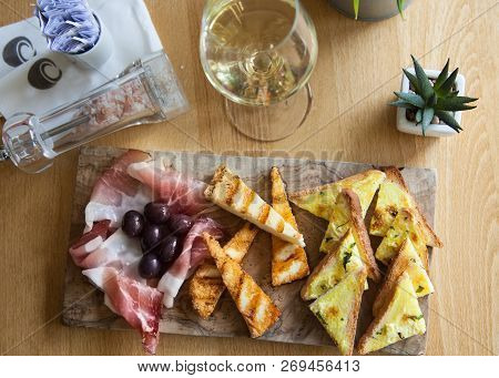 Appetizers Table With Italian Antipasti Snacks And Wine In Glass. Brushetta Or Authentic Traditional