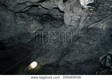 Beautiful Cave. View From Inside Dark Dungeon. Textured Walls Of Cave. Background Image Of Undergrou