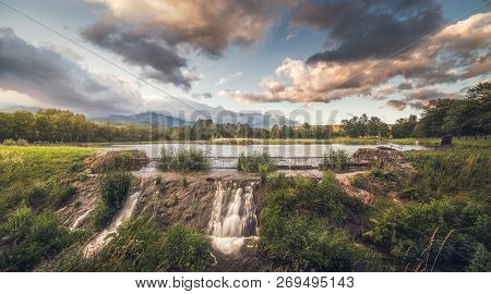 Strba Pond Lit By Golden Light At Sunset With High Tatras Mountains In Background, Slovakia.