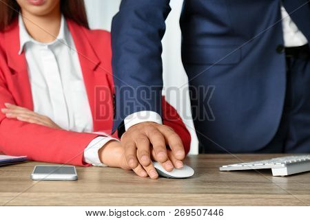 Boss Molesting His Female Secretary In Office, Closeup. Sexual Harassment At Work