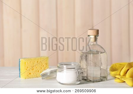 Composition With Vinegar, Baking Soda And Cleaning Supplies On Table