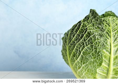 Savoy Cabbage On Table Against Color Background, Closeup. Space For Text