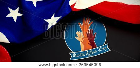 Martin Luther king day with hands against american flag on blank slate