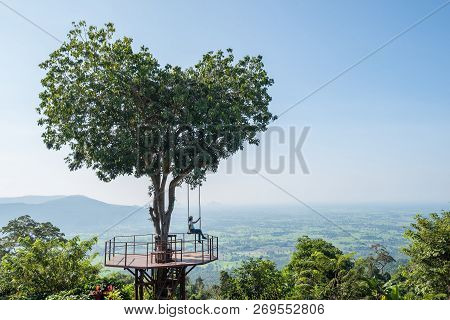 Phitsanulok ,thailand - October 12,2018 : The Thai Tourist Enjoy With Swing On Giant Heart Tree In 