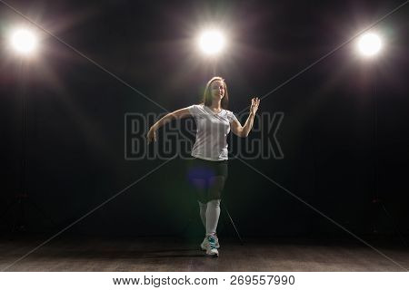 Hip-hop, Jazz-funk, Tecktonik, Waacking, Trance And Street Dances Concept - Young Woman Dancing Jazz