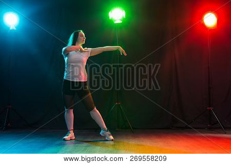 Hip-hop, Jazz-funk, Tecktonik, Waacking, Trance And Street Dances Concept - Young Woman Dancing Jazz