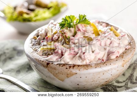 Swabian Sausage Salad - Elsasser Wurstsalat On Wooden Background.