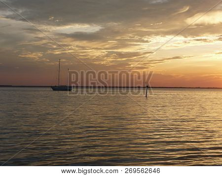 Anchored Sailboat. Sunrise On Captiva Island Florida, Over Pine Island Sound.