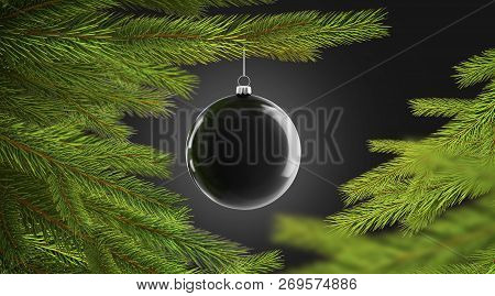 Blank Black Christmas Tree Ball Hanging On Pine Mockup, Isolated On Dark Background, Depth Of Field,