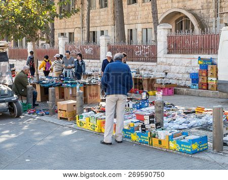 Jerusalem, Israel, November 17, 2018 : A Street Vendor Sells Various Things By Putting Them Out On T