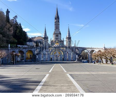 The Courtyard In Front Of The Cathedral Of Notre Dame In Lourdes, France