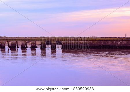Purple Sunset At The Junction Of River Blyth And Dunwich River In Southwold, A Popular Seaside Town 