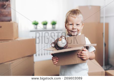 Cute Toddler Helping Out Packing Boxes